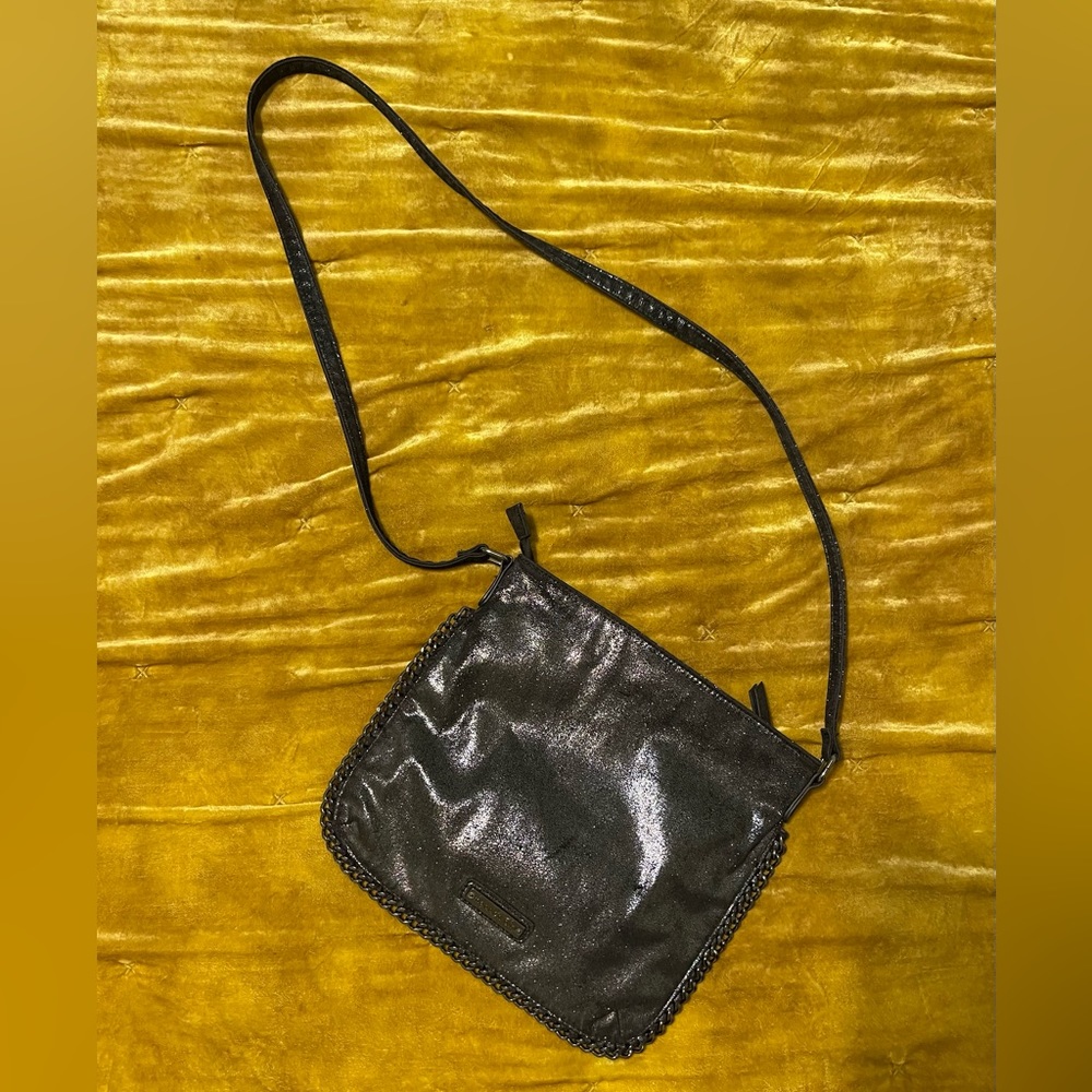Metallic…shimmery…charcoal/black Madden Girl crossbody with black chain trim.